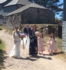 Bride walking from house